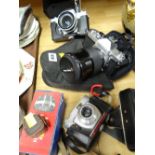 A Praktica camera, Nikkormat camera plus another etc
