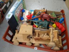 Crate of various children's toys including wooden train set, plastic animals etc