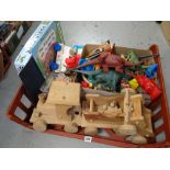 Crate of various children's toys including wooden train set, plastic animals etc