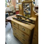 A vintage stripped pine mirror backed chest of drawers