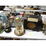 A vintage oak dome topped mantel clock, glass domed clock, vintage Bakelite-style radio etc