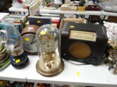 A vintage oak dome topped mantel clock, glass domed clock, vintage Bakelite-style radio etc