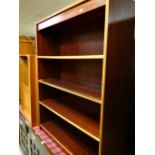 A modern low dark wood bookcase