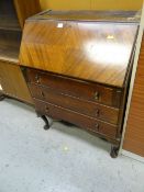 A vintage mahogany bureau base together with a vintage sliding door bookcase