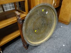 An Indian pierced brass topped benares table