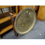 An Indian pierced brass topped benares table