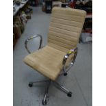 A modern chrome & light suede office chair