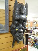 A large African tribal carved face mask