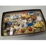 A collection of mainly Russian military insignia together with a bag of various enamelled pin