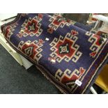 An old Baluchi woollen hand knotted rug in purple & red geometric pattern, 138 x 90cms