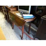 A small drop leaf dining table