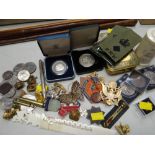 A parcel of mainly military collectables including badges, commemorative coins, Queen Mary, WWI