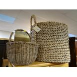 A large wicker log basket together with a shopping basket