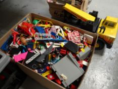 A Tonka toy crane together with a box of used Lego & other children's building bricks