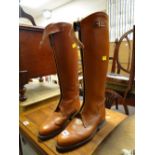 A pair of tan leather riding boots