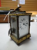 Brass mantel clock with Roman numeral face