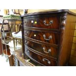 A reproduction Georgian-style mahogany bow fronted four-drawer chest of drawers