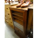 A modern walnut effect music cabinet