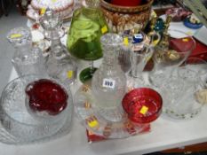 Three decanters, cut glass bowls etc