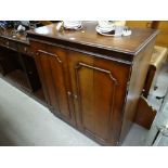 Reproduction mahogany narrow bookcase with three drawers together with a reproduction mahogany TV