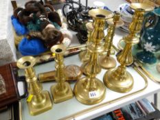 Four pairs of various brass candlesticks, copper & brass powder flask, Oriental dagger