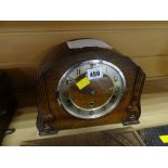 A vintage oak cased dome topped Westminster Chimes mantel clock