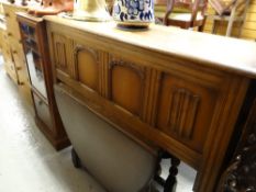 An oak Old Charm-style coffer together with a similar oak drop leaf dining table