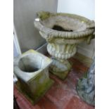 A RECONSTITUTED STONE CAMPANA STYLE GARDEN URN on associated stand, 104 cms high overall