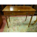 A VICTORIAN MAHOGANY SINGLE DRAWER SIDE TABLE on turned tapering supports, 77.5 cms high, 93 cms