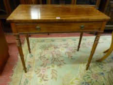 A VICTORIAN MAHOGANY SINGLE DRAWER SIDE TABLE on turned tapering supports, 77.5 cms high, 93 cms