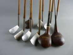 A COLLECTION OF HICKORY SHAFTED GOLF CLUBS including a one, a two and a three iron, a deep face