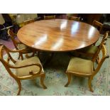 A REGENCY STYLE WALNUT CIRCULAR DINING TABLE and eight (six plus two) dining chairs, the 180 cms