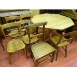 AN EDWARDIAN OAK OCTAGONAL TOPPED TABLE and six vintage farmhouse chairs (five and one), 75.5 cms