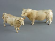 A BESWICK POTTERY CHAROLAIS BULL C2463 and a Charolais cow C3075, both boxed, 23 and 20 cms long