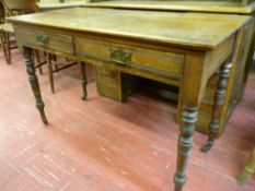 AN EDWARDIAN MAHOGANY TWO TIER SIDE TABLE having twin frieze drawers on turned and block supports