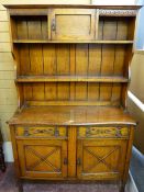 A VINTAGE OAK DRESSER SIDEBOARD, the top with centre cupboard doors and flanking shelves with