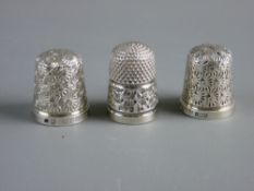 THREE HALLMARKED SILVER THIMBLES, one for Chester 1922 and two Birmingham 1959 and 1961