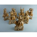 SEVEN WELL CARVED CHINESE SANDALWOOD FIGURES depicting various Gods mounted on mythical beasts on