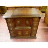 A GOOD WALNUT CASED SINGER SEWING MACHINE TABLE, the lift-up lid with pop-out treadle sewing