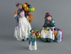 THREE ROYAL DOULTON CHINA FIGURINES - 'Biddy Penny Farthing' HN1843, 'The Balloon Seller' HN2130 and