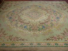A VINTAGE TUFTED WOOLLEN CARPET having a central floral cartouche and spandrel corners with a single
