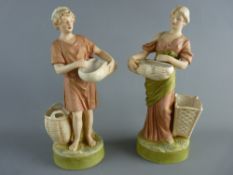 A PAIR OF ROYAL DUX FIGURINES of a young man and woman with baskets in typically muted colours and