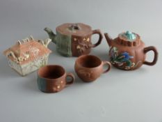 A GROUP OF CHINESE YIXING TERRACOTTA TYPE TEAWARE and a Japanese ceramic teapot, forms include a