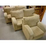 AN ULTRA MODERN THREE PIECE LOUNGE SUITE upholstered in barley tones comprising a pair of two seater