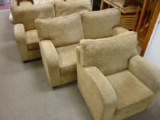 AN ULTRA MODERN THREE PIECE LOUNGE SUITE upholstered in barley tones comprising a pair of two seater