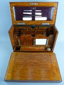 AN EXCELLENT LATE VICTORIAN OAK TABLETOP STATIONERY CABINET having twin carry handles and shield
