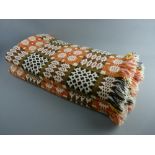 AN EXCELLENT TRADITIONAL WELSH WOOLLEN BLANKET having reverse patterns of orange, cream and