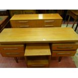 A STYLISH G-PLAN TEAK DRESSING TABLE with matching eight drawer chest and single drawer bedside