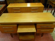 A STYLISH G-PLAN TEAK DRESSING TABLE with matching eight drawer chest and single drawer bedside