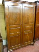 A VICTORIAN MAHOGANY CHAMFERED PANEL FRONT TWO DOOR WARDROBE, the twin three panel doors opening